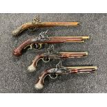 A box of four replica flintlock pistols CONDITION REPORT: Postage quote UK £15 + vat.