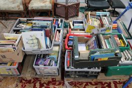 Two pallets containing assorted books - reference, heraldry, photography, novels,