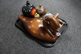 A tray of wooden pieces, duck, lidded tobacco jar, antique treen Ripon cathedral jar,