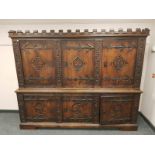 A good quality carved oak sideboard, with castellated frieze,