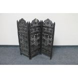 A small carved hardwood three fold fretwork screen