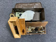 A vintage metal ammunition tin containing gun cleaning equipment