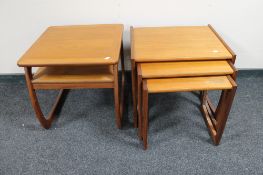 A nest of three teak G Plan tables and a teak Nathan side table