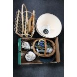 A wicker magazine rack containing folding tables, box of wicker hand basket, Scottish pottery bowl,