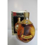 A bottle of John Haig Dimple Deluxe Scotch Whisky 26 2/3 fl. oz.