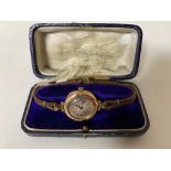 A 9ct gold lady's wristwatch on leather strap