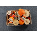 A box containing Le Creuset kitchen ware to include soup pots, mugs, pepper cellar,