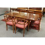 A mid 20th century extending dining room table and six carver armchairs, 182 cm x 91.