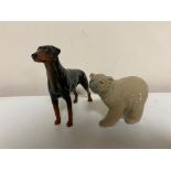 A Lladro figure of a polar bear together with a Beswick doberman