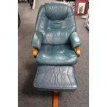 A beech framed blue leather swivel relaxer chair with stool