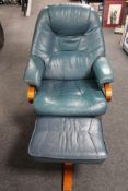 A beech framed blue leather swivel relaxer chair with stool