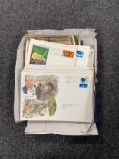 A box of twentieth century postcards and first day covers