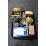 A tray of vintage marbles, tea cards, brass ware, field glasses,