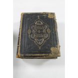 A nineteenth century leather bound family bible containing monochrome plates