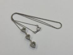 A 10ct white gold diamond set heart pendant on chain CONDITION REPORT: Chain length