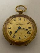 A brass cased Swiss ivy lady's pocket watch