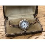 A lady's vintage 18ct gold diamond set cocktail watch on 9ct gold bracelet