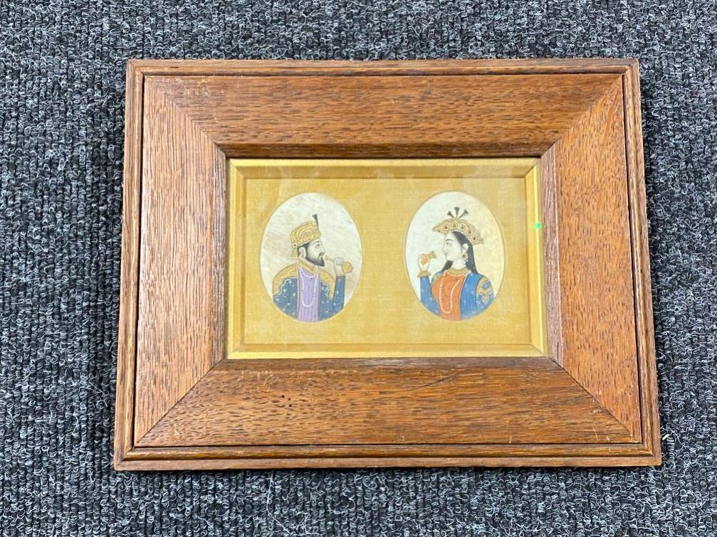 A pair of 19th century Indian gouache paintings on ivory of a nobleman and woman, framed as one.
