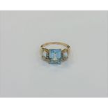 A 10ct gold diamond and topaz ring,