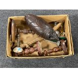 A box of carved hardwood wall mask, carved figure of a crocodile, wooden candlesticks,