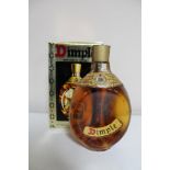 A bottle of John Haig Dimple Deluxe Scotch Whisky 26 2/3 fl. oz.