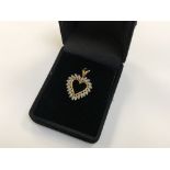 A 10ct gold diamond set heart pendant