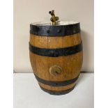 An oak coopered sherry barrel with brass tap