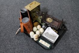 A tray of cased binoculars, brass carriage clock, two onyx ashtrays,