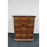 An Eastern hardwood twelve drawer chest