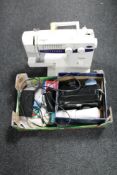 A Brother XL5021 electric sewing machine with pedal together with a box of sewing accessories