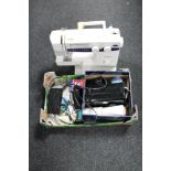 A Brother XL5021 electric sewing machine with pedal together with a box of sewing accessories