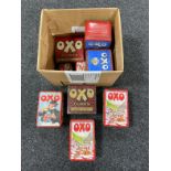 A box of assorted Oxo tins