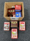 A box of assorted Oxo tins