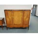 An inlaid walnut triple door side cabinet,