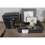 A 20th century five drawer desk top chest and a box of pictures, companion pieces, metal cash box,