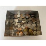 A vintage tin of pre decimal coins,