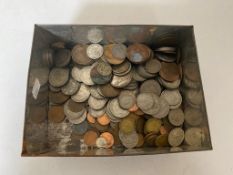 A vintage tin of pre decimal coins,