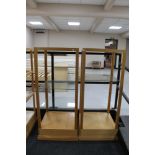 Two square four tier shop display stands (one glass panels missing)