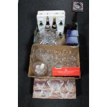 Two boxes of drinking glasses, two bottles of wine, two-tone wine glasses,