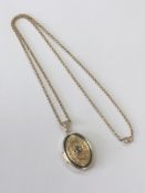 A 14ct gold gem-set locket and chain, 7.9g gross.