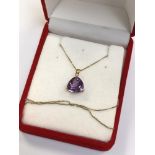 A 14ct gold amethyst pendant on chain CONDITION REPORT: The chain has a bale marked