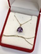 A 14ct gold amethyst pendant on chain CONDITION REPORT: The chain has a bale marked