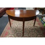 A Victorian mahogany demi-lune table