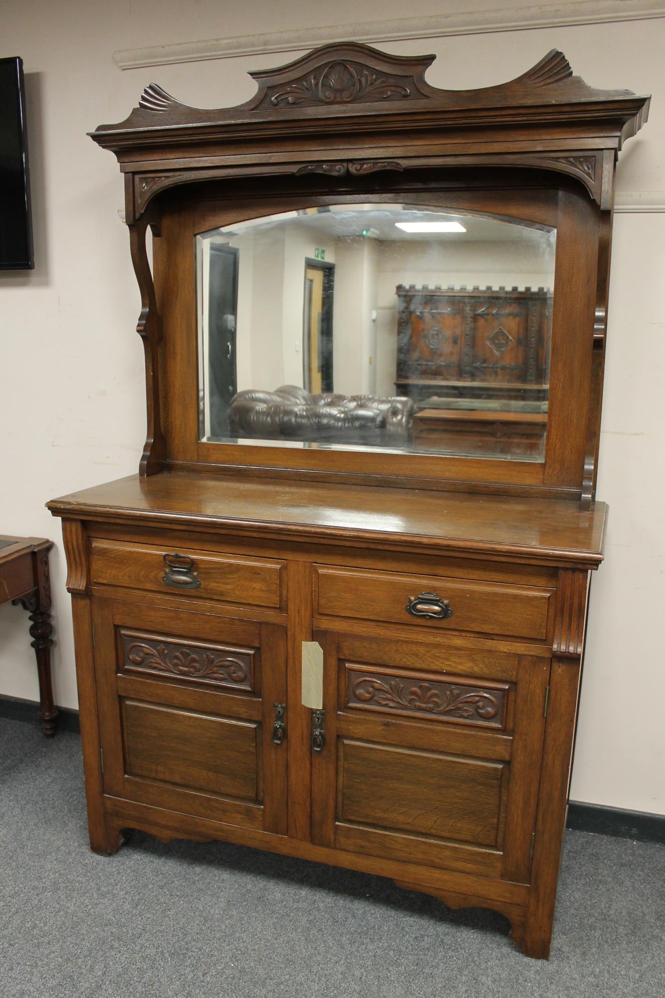 A late Victorian oak mirror backed sideboard,