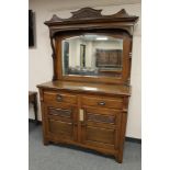 A late Victorian oak mirror backed sideboard,