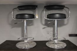 Two gas lift bar chairs
