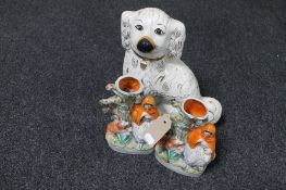 A pair of Staffordshire flat backed spill vases together with a Staffordshire spaniel with glass