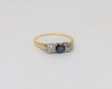 A yellow gold two stone diamond and sapphire ring,