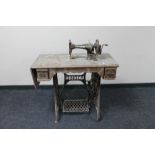 A vintage treadle sewing machine in table