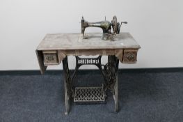 A vintage treadle sewing machine in table